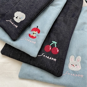 Detailed embroidery of dog, apple, cherry and rabbit patterns on denim fabric bags
