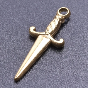 Macro shot of a vintage gold dagger sword pendant with textured matte stainless steel finish