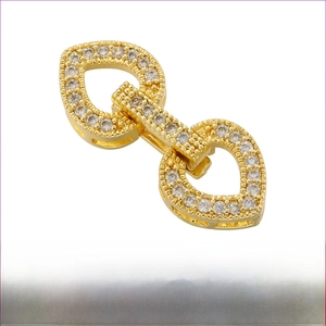 Close-up of gold-plated brass heart clasp with cubic zirconia pave and dimensions