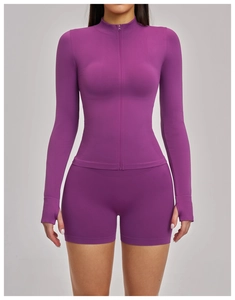 Close-up of plum yoga set featuring stand collar zipper jacket and thumbhole sleeves