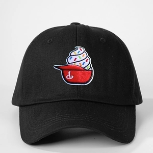 Close-up of ice cream embroidery with colorful sprinkles on black cotton baseball cap