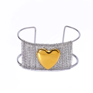 Minimalist silver woven stainless steel open bangle with a large 18k gold heart centerpiece