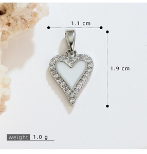 Detail of silver heart pendant necklace with zircon border and size dimensions