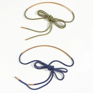 Army green and navy blue knotted wax rope waist belts with gold metal rings on white background