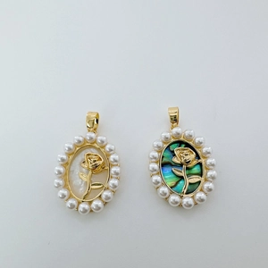 Detail of 18K gold rose pendants with pearl edges and white or green abalone shells