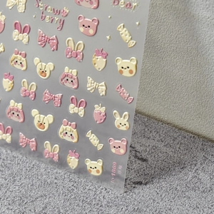 3D embossed nail art stickers featuring cute strawberry bear and bowknot patterns