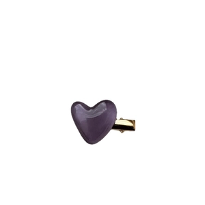 Cute translucent purple heart hair clip with a golden metal duckbill base on white background
