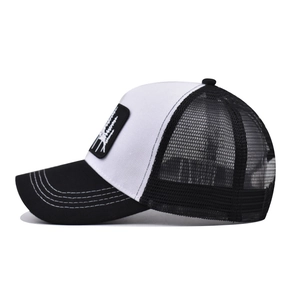 Black and white mesh trucker hat featuring moon tree embroidery and breathable back