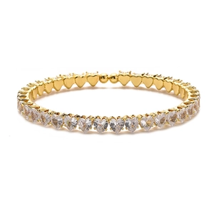 Detail of gold-plated bangle featuring sparkling heart-shaped cubic zirconia stones