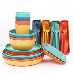 Eco-friendly wheat straw dinnerware set with bowls, plates, and cups in assorted colors