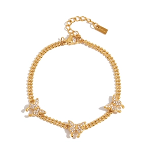 Detail of gold double-chain bracelet with sparkling zircon butterfly charms and S. steel tag