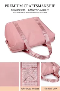 Detailed view of the pink foldable travel bag showing reinforced handles and stitching