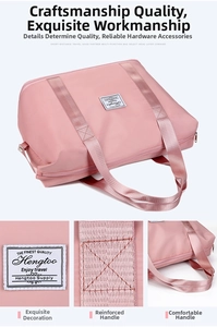 Detailed view of the pink foldable travel bag showing reinforced handles and stitching