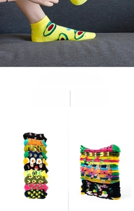 Detail of colorful low-cut ankle socks featuring avocado, sushi and fruit patterns