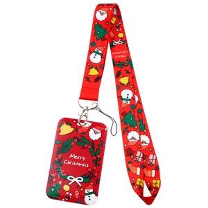 Detail of red Christmas lanyard with Merry Christmas text and cartoon patterns