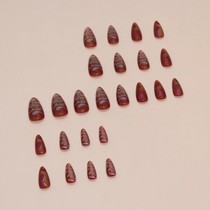 Cat eye press-on nails with red marble pattern and gold glitter in 24-piece almond set