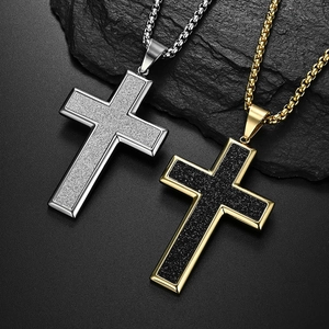 Minimalist large titanium steel cross necklaces in gold and silver on dark rock background