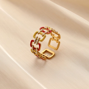 Elegant gold chain-link open ring with colorful enamel inlay on beige satin background