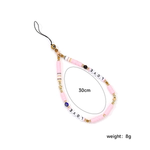 Pink handmade phone charm with LOVE letter beads and stars, 30cm length detail view
