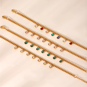 Detailed view of Cuban chain bracelets featuring multi-colored teardrop zircon charms