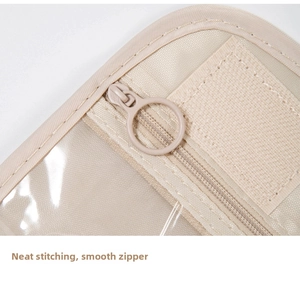 Detail of hanging toiletry bag showing neat stitching and smooth beige zipper mechanism