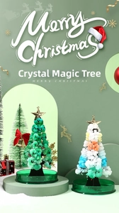 Detail showing colorful crystal growth magic tree with gold star and festive decorations