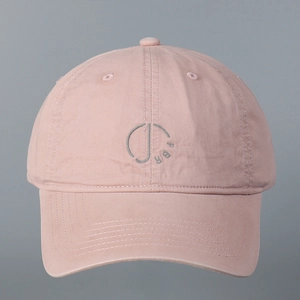 Detailed embroidery of FBR logo on pink washed cotton baseball cap with curved brim