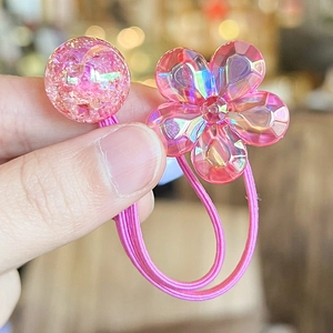 Pink camellia flower hair tie with shimmering glitter bead and elastic elastic band