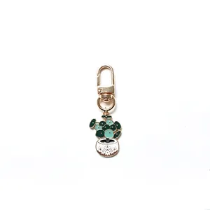 Creative potted plant keychain with golden alloy lobster clasp and green enamel charm