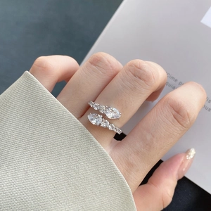 Macro detail of S925 sterling silver ring featuring sparkling drop-shaped cubic zirconia stones