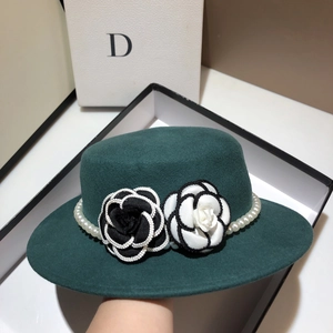 Elegant dark green wool flat top hat with camellia flowers and pearl chain trim