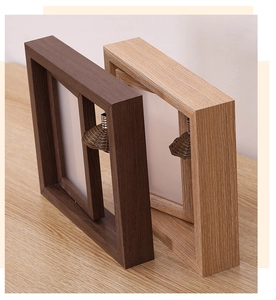Detail of wooden rotating frame featuring heart-shaped pendant and side wood grain texture