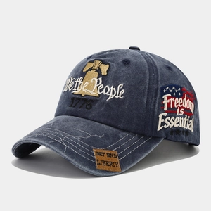 Detail view of washed navy cotton baseball cap with American 1776 embroidery and Freedom patches