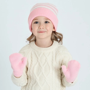 Close-up of pink striped knit beanie and matching mittens set on a child model
