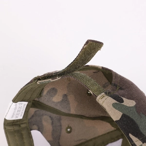 Close-up of adjustable velcro strap and 100% polyester label on camo baseball cap