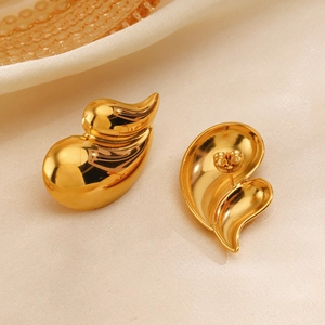 Elegant 18K gold plated water drop earrings with pearl inlay on soft beige silk