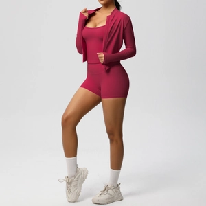 Three-piece berry red yoga set showing zip-up jacket, sports tank top and biker shorts