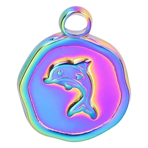 Macro detail of rainbow stainless steel round pendant with embossed dolphin design