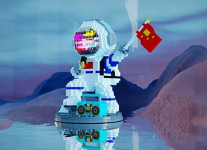 Detail of astronaut building block model with radio accessory on water reflection