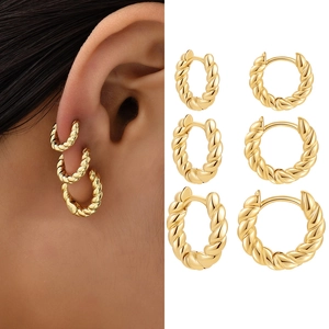 Three pairs of golden twisted rope hoop earrings in small, medium, and large sizes