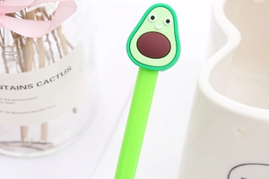 Close-up of a cute green avocado shaped silicone gel pen for students and office