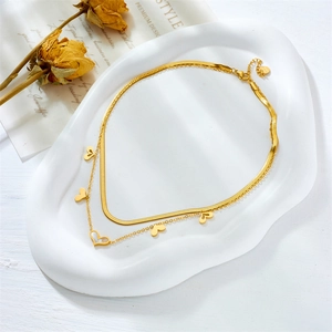 Double layer stainless steel necklace featuring gold snake chain and heart pendants