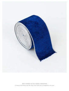 Close-up of dark blue velvet ribbon with silver edges for Christmas tree decoration