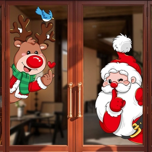 Christmas window stickers featuring cartoon Santa Claus and reindeer on a glass door