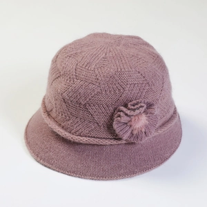 Detail of dark purple knit hat with texture weave and handmade 3D floral decoration