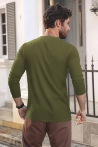 Outdoor shot showing the fit and back view of a men's olive green long-sleeve polo shirt