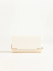 Close-up of elegant white PU leather clutch bag with luxury gold metal corner accents