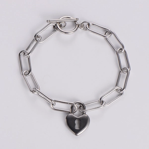 Minimalist silver heart lock bracelet with paperclip chain and OT toggle clasp closure