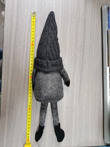 Detailed view of grey knitted Christmas gnome showing 41cm height measurement with tape