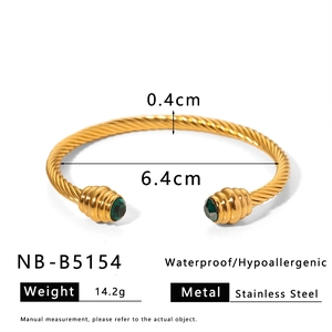 Detailed dimensions of gold cable cuff bracelet with green gemstones and stainless steel